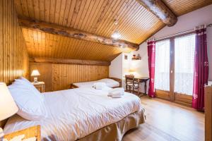 Ένα ή περισσότερα κρεβάτια σε δωμάτιο στο Chalet Le Refuge