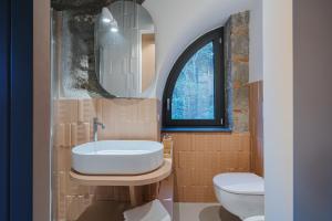 a bathroom with a sink and a toilet and a mirror at L'Appoggio in Castellammare di Stabia +22 photos