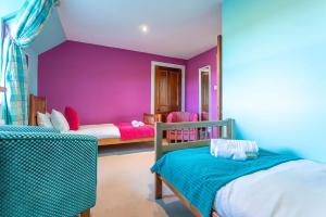 En eller flere senge i et værelse på Swilken Lodge - Blacklaws Steading