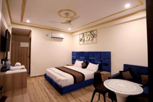 En eller flere senge i et værelse på Riverline Gold Resort