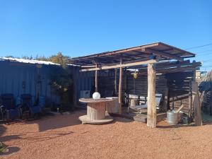 a wooden pergola with a table in a yard at Asahi Seaside Cottage - Vacation STAY 42134v in Asahi