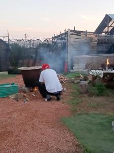 a man kneeling down in front of a bath tub at Asahi Seaside Cottage - Vacation STAY 42134v in Asahi