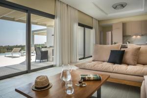 a living room with a couch and a table at Villa Stellina in Karavádhos