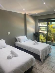 En eller flere senge i et værelse på City and Sea 1-4 Guests