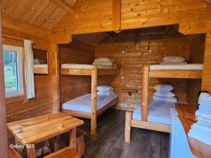 a cabin with four bunk beds in it at Kalana Holiday Resort in Kalana