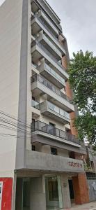a tall building with balconies on the side of it at DEPARTAMENTO a ESTRENAR - TUCUMAN in San Miguel de Tucumán