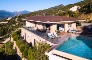 an aerial view of a house with a swimming pool at Villa Supranu in Viggianello