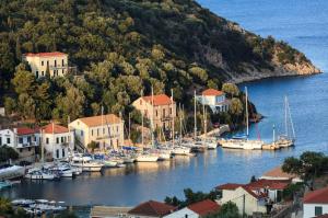 a group of boats are docked in a harbor at Villa Alba in Vathi, Ithaka