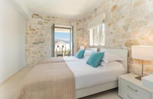 Postel nebo postele na pokoji v ubytování Villa Taphian + 18 fotografií