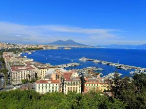 an aerial view of a city and the water at Victry's Houses Chiaia in Naples