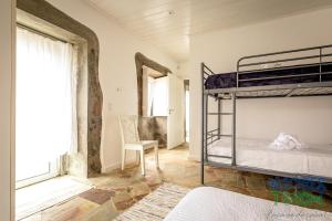 Ένα ή περισσότερα κρεβάτια σε δωμάτιο στο Casa dos Calços