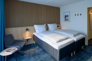 Ένα ή περισσότερα κρεβάτια σε δωμάτιο στο Hotel Faaborg Fjord +29 φωτογραφίες