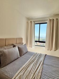 En eller flere senge i et værelse på Vista Mar • Piscina & Jacuzzi • Cond. Completo + 27 billeder