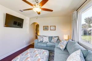 a living room with a couch and a ceiling fan at 8 Mi to Dtwn New Orleans! Newly Renovated Home in Metairie
