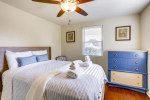a bedroom with a bed and a ceiling fan at 8 Mi to Dtwn New Orleans! Newly Renovated Home in Metairie