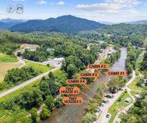 an aerial view of a road signs and a river at Laurel Bush Combo - 6 Waterfront Homes, Fish, Hike, and Mountain Views! in Sylva