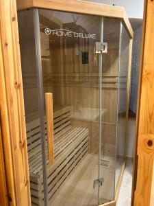 a glass display case in a wooden cabinet at Golavškov mlin - Eco Heritage Boutique Stay in Prebold +71 photos