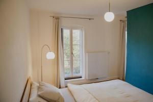 Ένα ή περισσότερα κρεβάτια σε δωμάτιο στο Das Karo