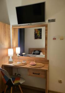 Телевизор и/или развлекательный центр в Pokoje Gościnne U Anny