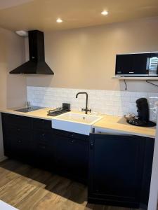 Η κουζίνα ή μικρή κουζίνα στο Les Iris - Maison Chaleureuse