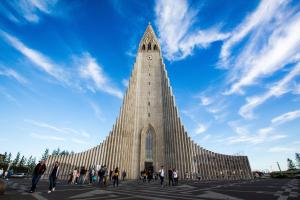 a large building with a tower with a clock on it at Hotel Leifur Eiriksson in Reykjavík +64 photos