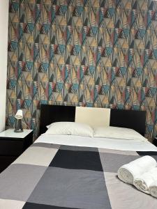 Кровать или кровати в номере Casa Felice a piazza Zama +13 фотографий