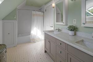a bathroom with two sinks and a tub and a shower at The New Victorian Mansion Bed & Breakfast in Saint Paul +74 photos