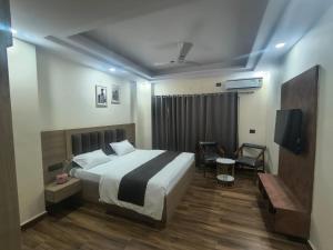 Postel nebo postele na pokoji v ubytování Expo Residency Inn