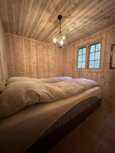 Postel nebo postele na pokoji v ubytování Mountain cabin in Hafjell with sauna - ski in-ski out