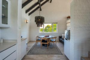 a kitchen and dining room with a table and chairs at Lieben Marelei in Sea Vista