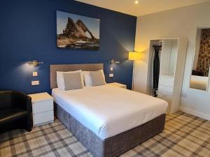 Rúm í herbergi á Poseidon's