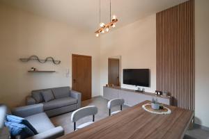 a living room with a couch and a table at Sands Guesthouse Apartment 03 In Batroun in Batroûn