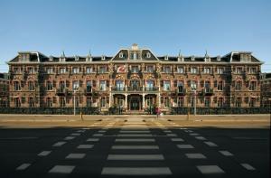 a large building on the side of a street at The Manor Amsterdam in Amsterdam