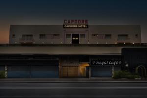 a building with a sign on top of it at asar Capoors Hotel Hazratganj by Orion Hotels in Lucknow