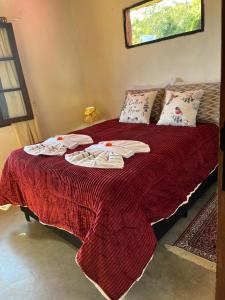 En eller flere senge i et værelse på Casa Beija flor