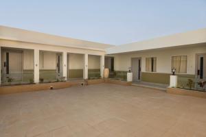 a large empty building with a large courtyard at asar Capoors Hotel by Orion Hotels in Lucknow