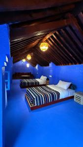 Giường trong phòng chung tại Dar Dadicilef +44 ảnh