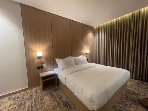 En eller flere senge i et værelse på فندق لايفان LYvAN HOTEL