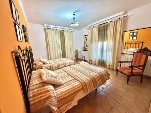 En eller flere senge i et værelse på CASA RuRAL LOS DESAYUNOS