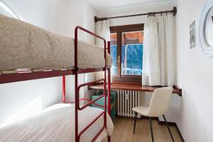 Postel nebo postele na pokoji v ubytování Casadegli Orsi Madonna Di Campiglio