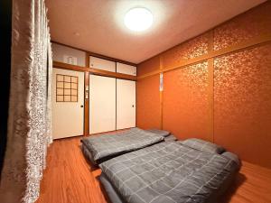 Кровать или кровати в номере Hirakata - House - Vacation STAY 20199