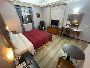 TV a/nebo společenská místnost v ubytování HX Motel - FengShan by HXgroup