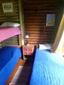 En eller flere senge i et værelse på Dielmeral Cabañas