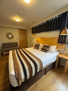 Ένα ή περισσότερα κρεβάτια σε δωμάτιο στο CASA CRISTOBAL Centenario