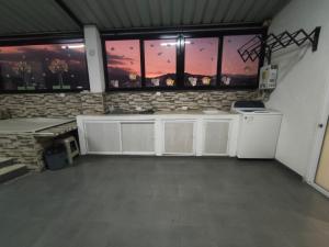 Kuchyň nebo kuchyňský kout v ubytování Hotel Detodito