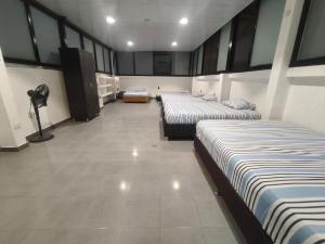 Postel nebo postele na pokoji v ubytování Hotel Detodito