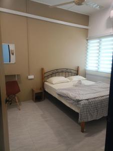 En eller flere senge i et værelse på Ipoh budget house