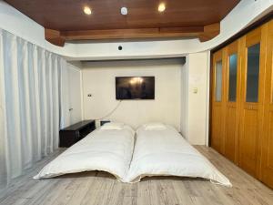 Ένα ή περισσότερα κρεβάτια σε δωμάτιο στο MARU KIX House