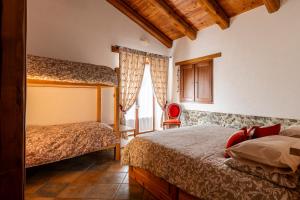 Ένα ή περισσότερα κρεβάτια σε δωμάτιο στο Agriturismo Ciambun