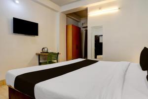 Postel nebo postele na pokoji v ubytování Collection O KIIT Square Bhubaneswar Formerly Nilay Classic + 23 fotografií